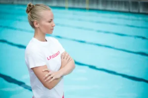 female-lifeguard-standing-at-poolside-2025-04-03-04-58-53-utc