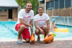 male-and-female-lifeguards-holding-rescue-cans-at-2025-04-03-09-24-32-utc